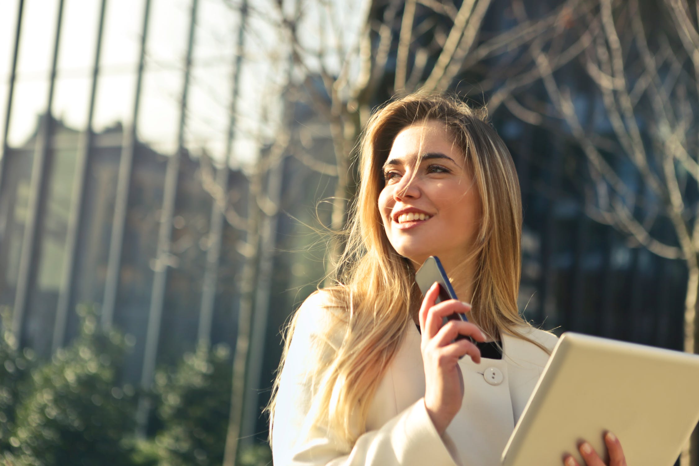 woman with phone and ipad