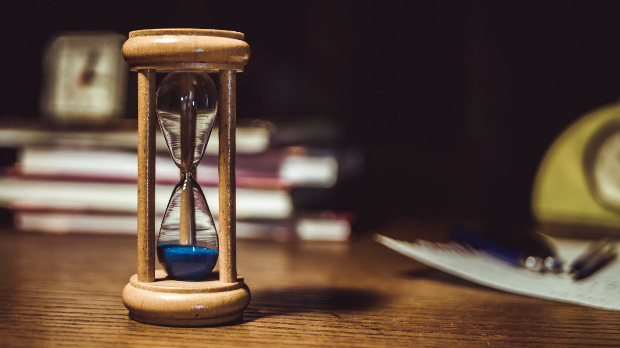 Brown hourglass with blue sand