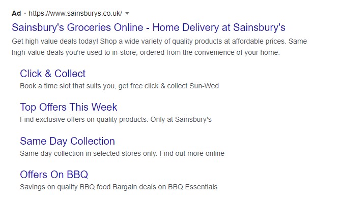 A Google Search ad with four sitelink extensions displayed