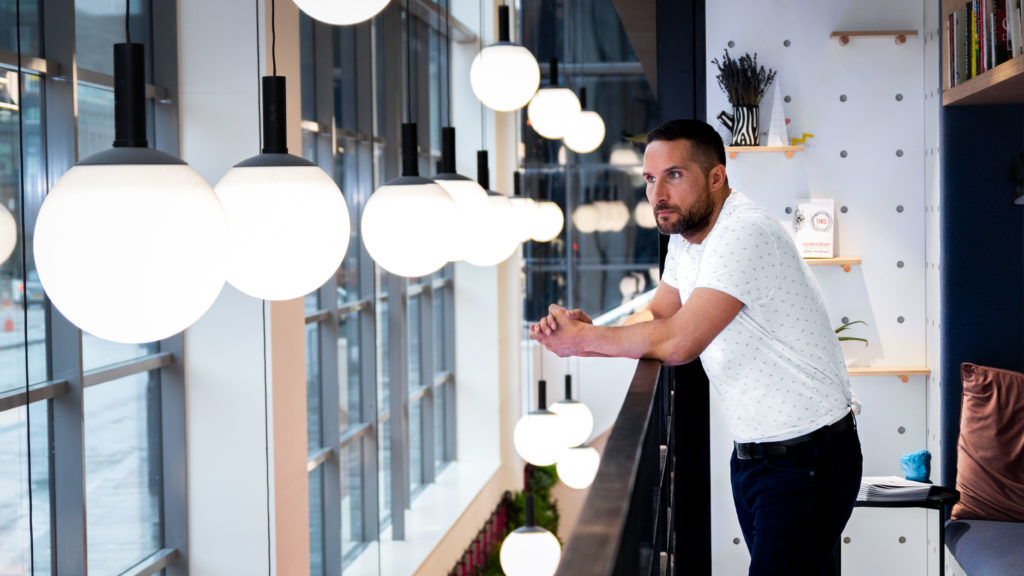 Our MD Chris photographed in our second office within Huckletree Manchester