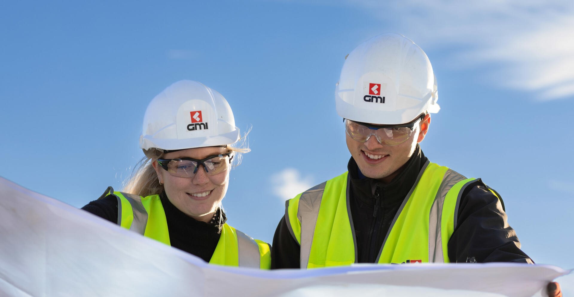 GMI Construction | Man and woman in hard-hats