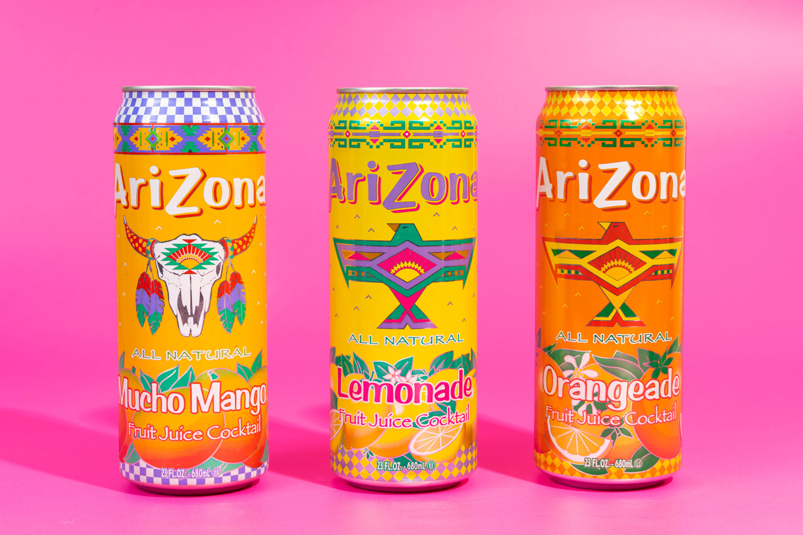 canned fizzy pop on a bright and colourful background