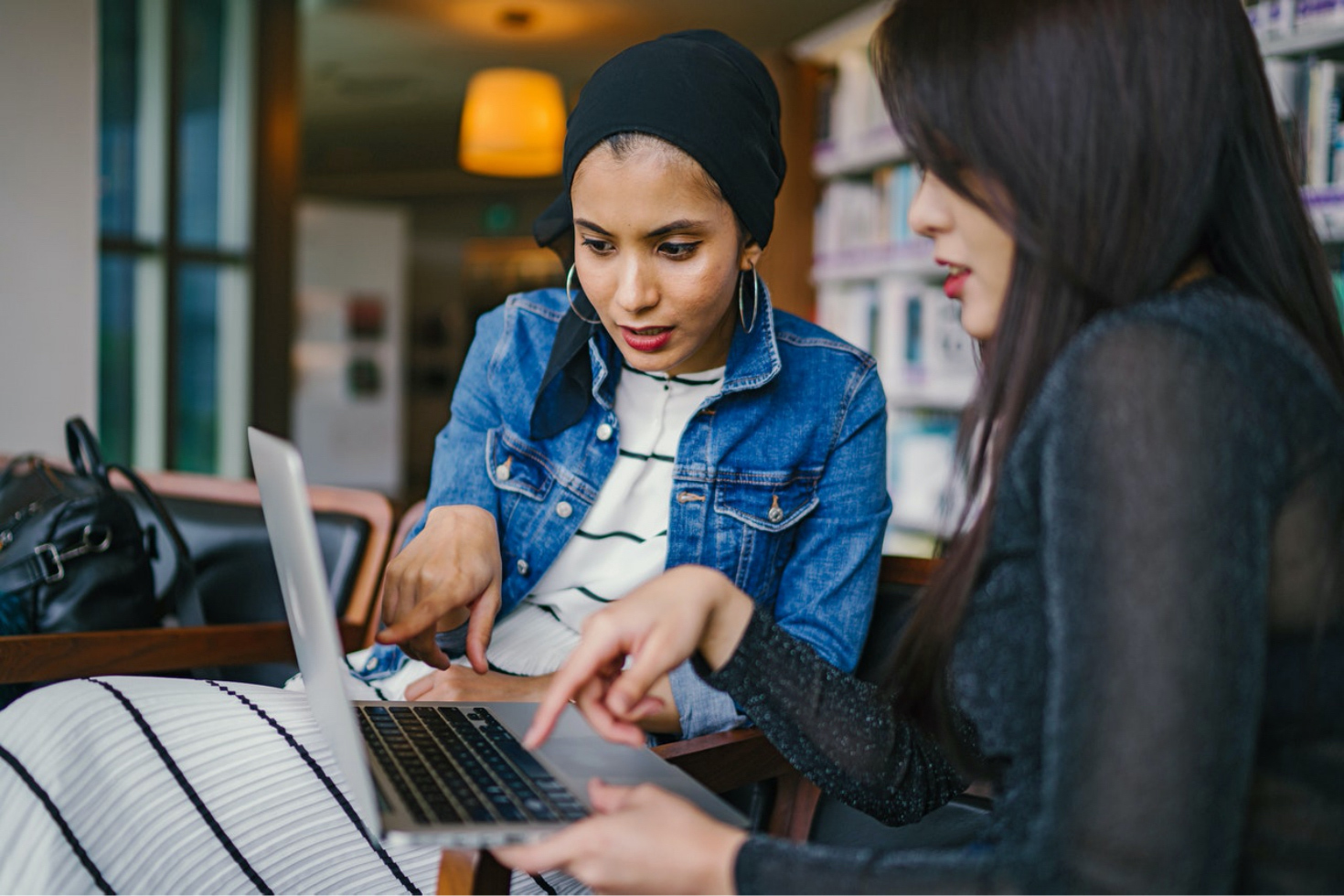 Mhance featured image - two women using Microsoft apps