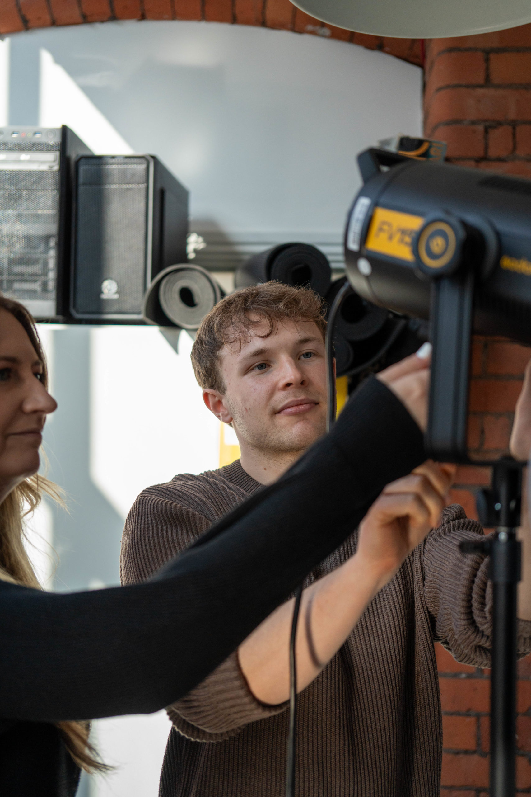 Faye Harry setting up light